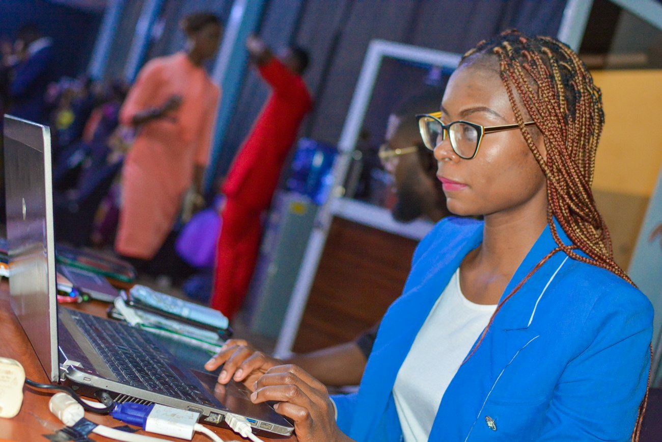 A school staff member working at a laptop
